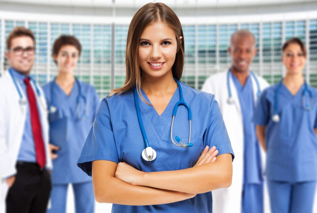 Doctor in front of a group of medical workers